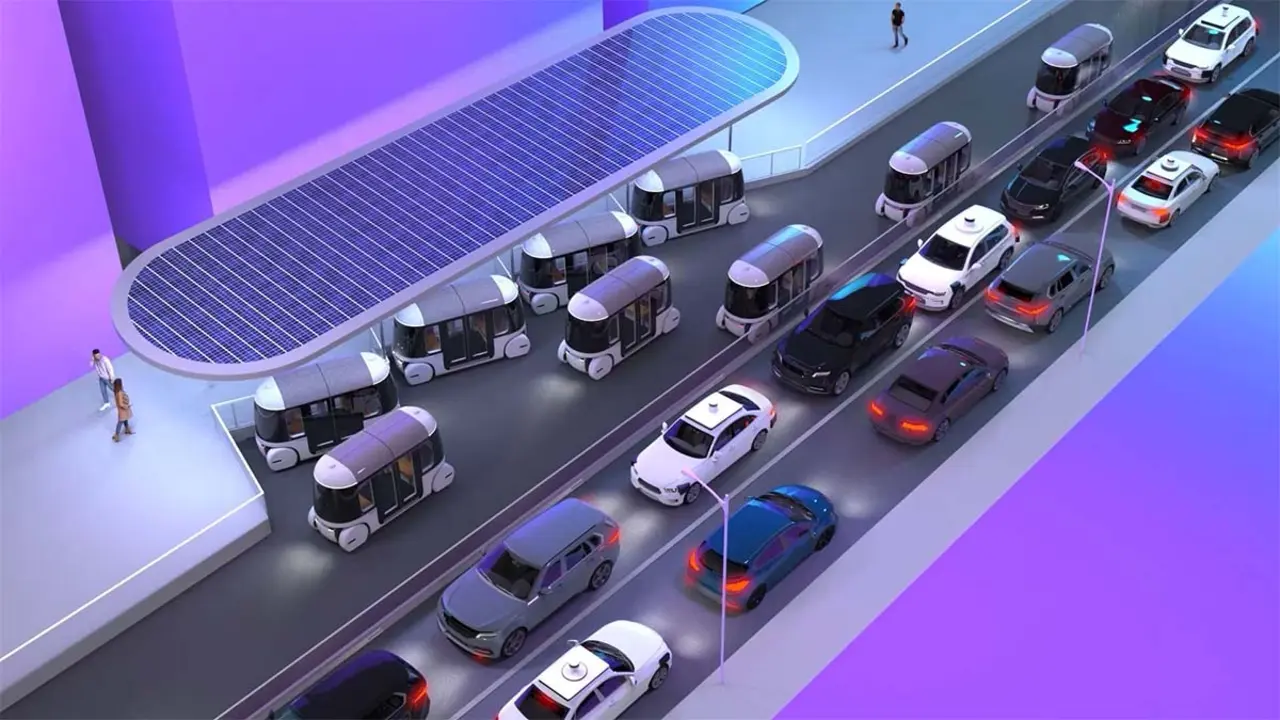 Imagen de autobuses y coches el&eacute;ctricos en una calle de Atlanta, mostrando la nueva red de transporte aut&oacute;nomo y sostenible.