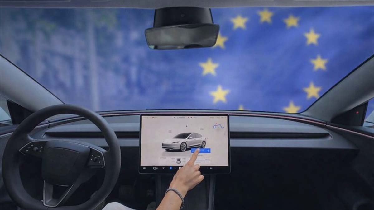 Tesla Model 3 en el interior, con pantalla táctil y bandera de la Unión Europea.
